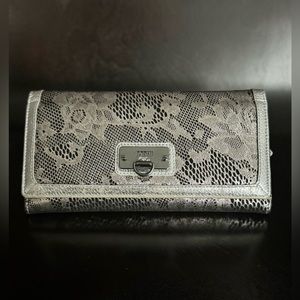 BODHI Large Wallet, Leather/Suede-like Material, worn once. 8 by 4 by 1 inches.